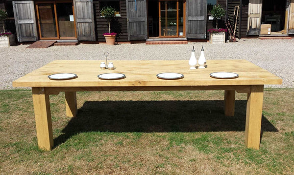 Large Outdoor Oak Dining Table in the garden