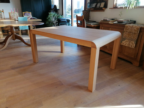 Fixed top Contempororay design table with curved ends