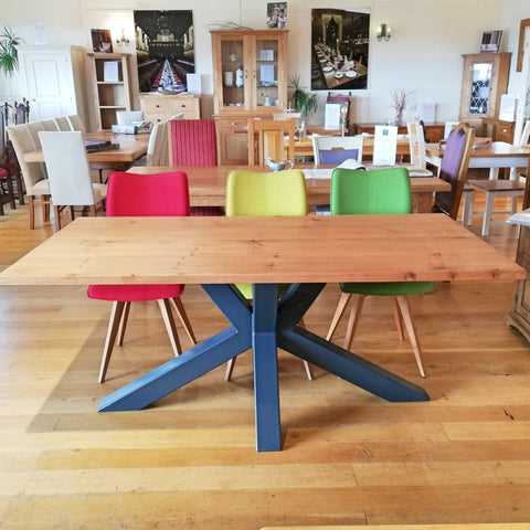 Welded angled steel base with a solid oak table top