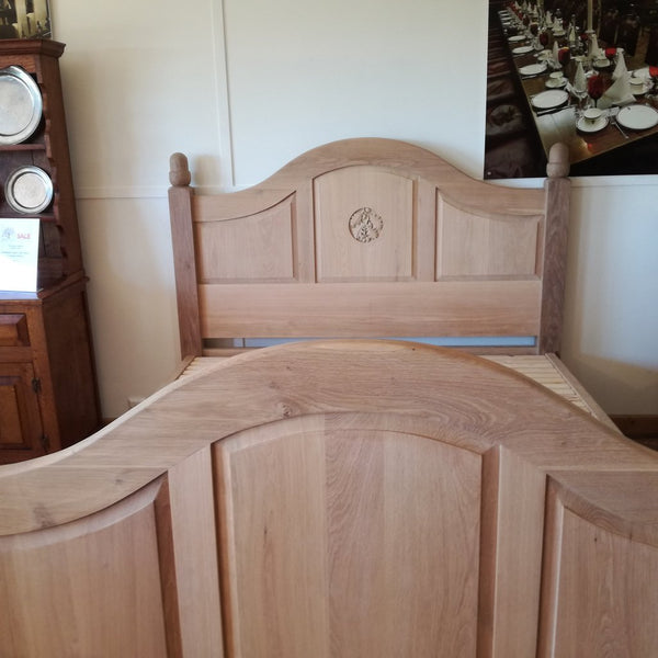 Grand Oak Bed with Storage end view