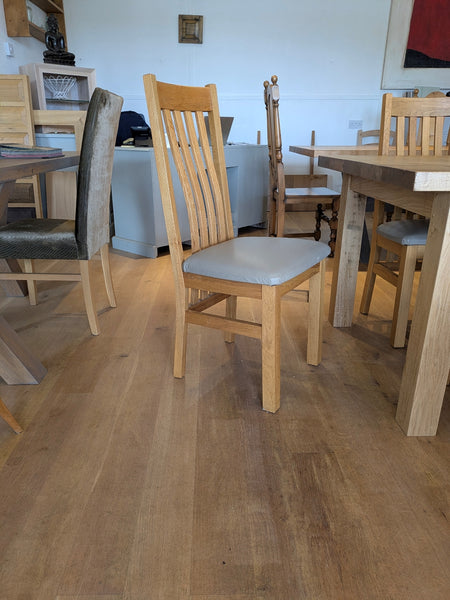 Oak dining chair with leather seat pad