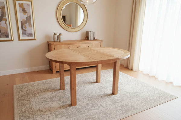 Round to oval centrally extending-oak table