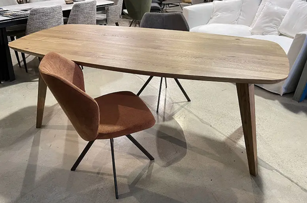 Solid oak dining table with curved corners
