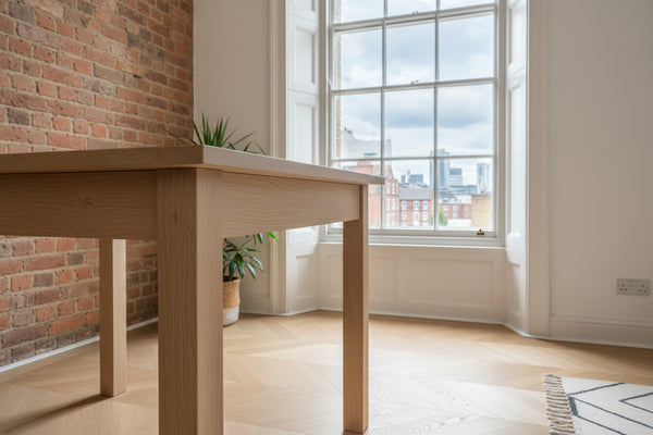 Close up corner view of Living handmade oak table in a London  apartment 