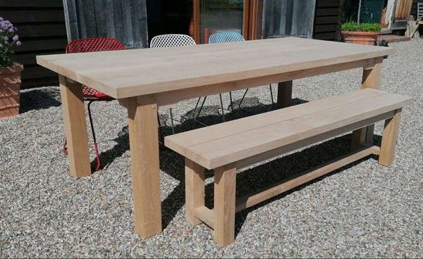 Outdoor Dining Furniture - Sussex Boarded Bench on gravel driveway outside Country Ways OAk Furniture Makers showroom and workshop in East Sussex