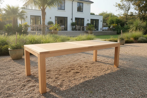 Handmade oak garden table in modern garden setting