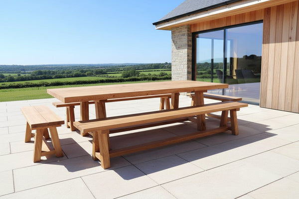garden table and benches on patio overlooking English countryside