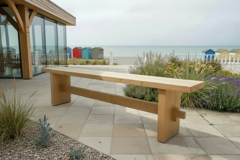 Outdoor Dining Furniture - Oak Slab End Bench on patio of beach front  house