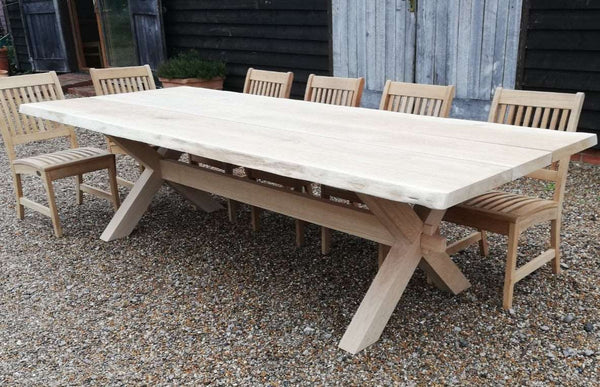 Handmade cross leg oak garden table with waney live edge top