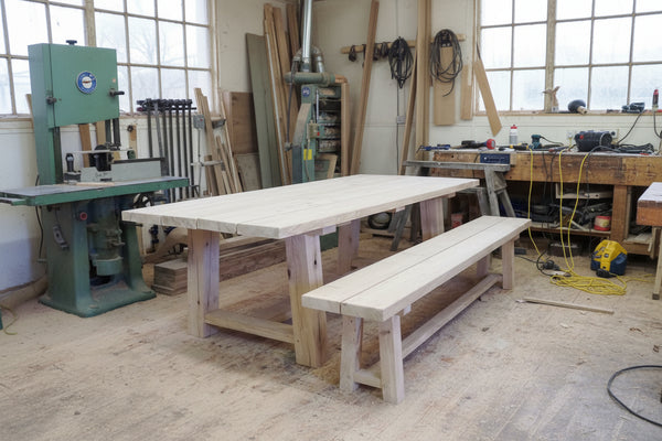 Large handmade trestle oak garden table and bench in our workshop