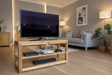 Oak TV cabinet with shelving in a living room