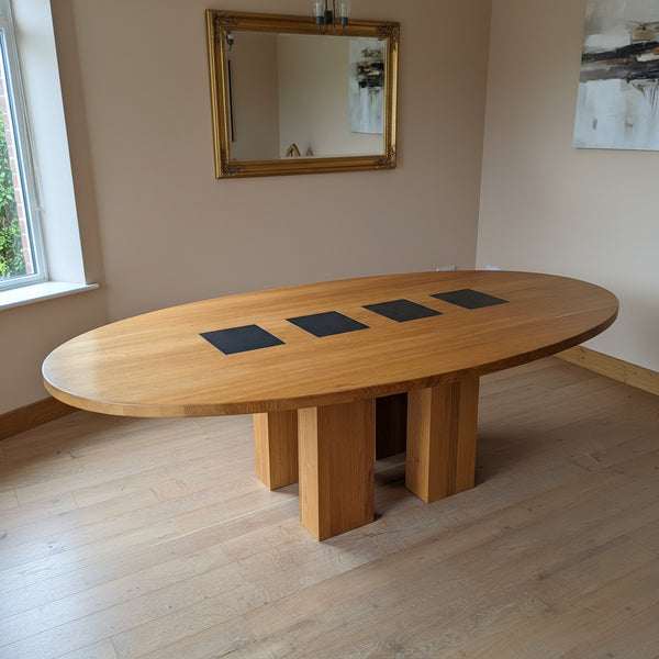Oval oak dining table with 4 slate inserts