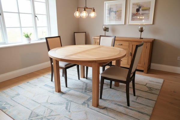 Round oak extending dining table natural lacquer finish