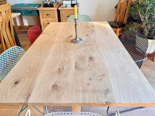 Close up of handmade Sussex solid oak fine pillar tabletop in a room setting