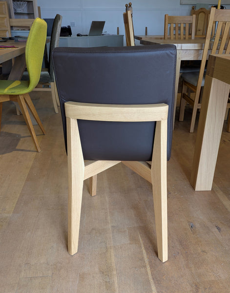 Contemporary oak dining chair with leather upholstery