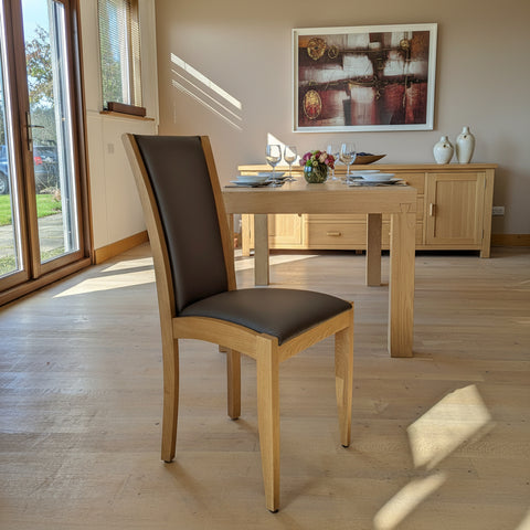 Contemporary upholstered oak dining chair in leather