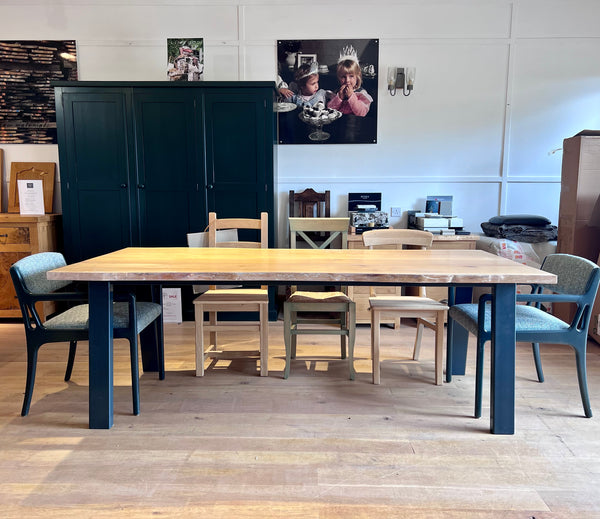 Waney Live edge dining table with handmade angled steel base by Country Ways Oak Furniture Makers