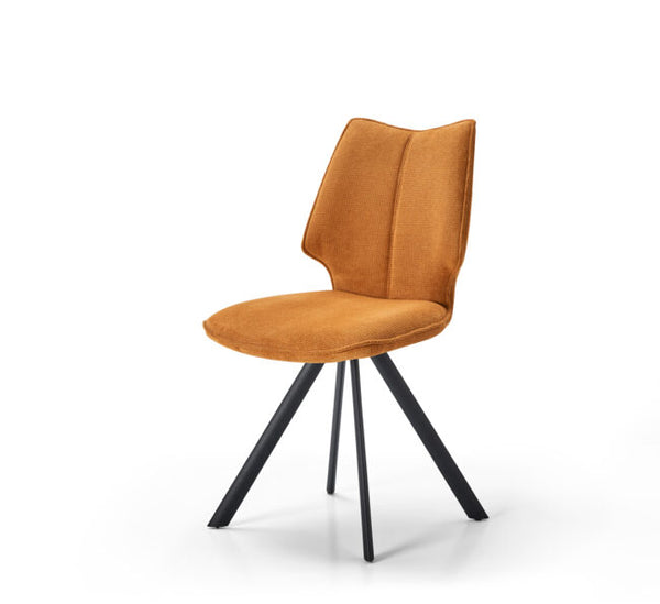 A modern side chair with a warm mustard-orange velvet upholstered seat and curved backrest, supported by a black metal tripod base, shown on a clean white background.