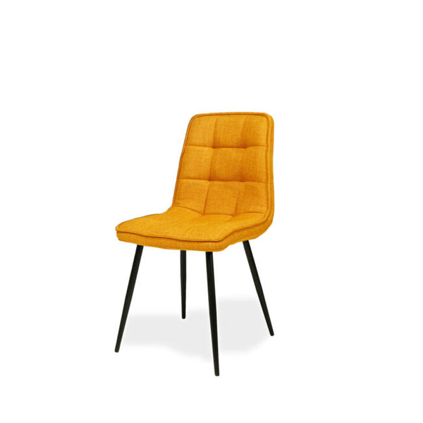 An upholstered dining chair with a mustard yellow tufted fabric seat and backrest, supported by four slim black metal legs, shown against a plain white background.