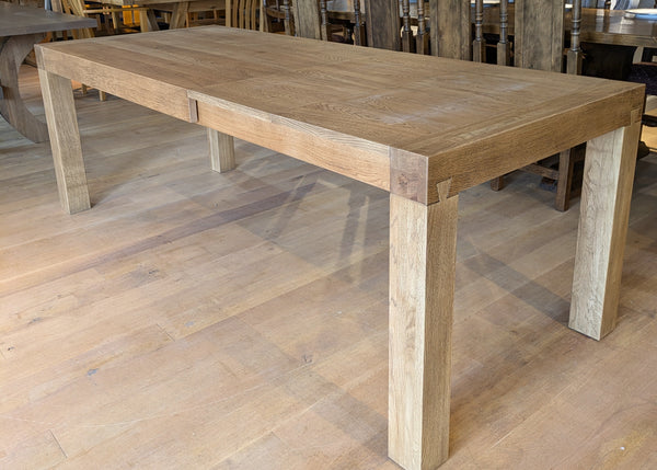 A handmade finished terra extending oakdining table