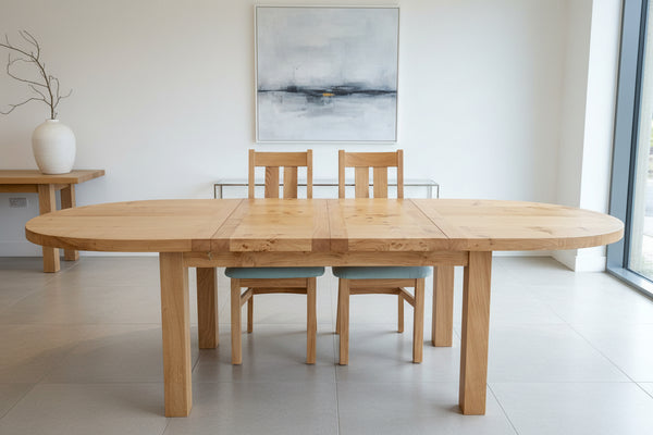 Fully extended view of handmade oval D-Ended extending dining table with 2 central leaves side view