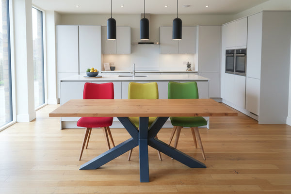 Welded angled steel base with a solid oak table top in a modern kitchen setting