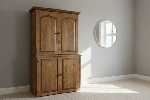 Handmade oak cabinet with two upper and two lower doors in a room setting.