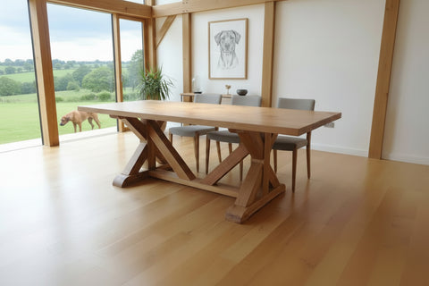 Cross braced oak dining table in a home in West Sussex with a Rhodesian Ridgeback in the garden