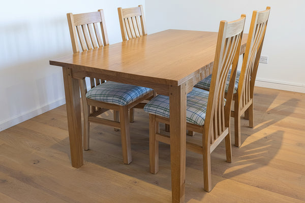 Sussex oak dining table with 28mm thick top tapered legs