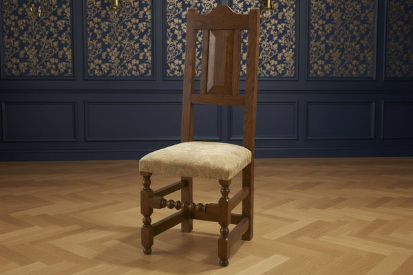 Sussex - English Oak 17C Side Chair with upholstered seat in a luxurious blue paneled room with wooden floor