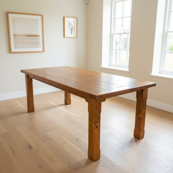 Handmade solid oak dining table with 4 x planks and breadboard ends in a medium oak colour