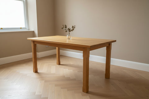 Handmade solid oak dining table in a light oak lacquered finish