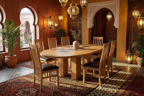 large oval oak dining table on  four columns with four slate inserts to top in a Moroccan inspired dining room