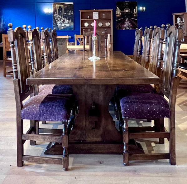 Reclaimed English Oak Lyre End Table with 8 side chairs and 2 carvers in a dark oak finish