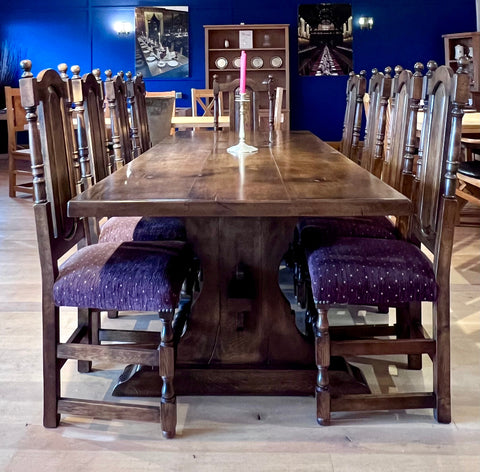 Reclaimed English Oak Lyre End Table with 8 side chairs and 2 carvers in a dark oak finish