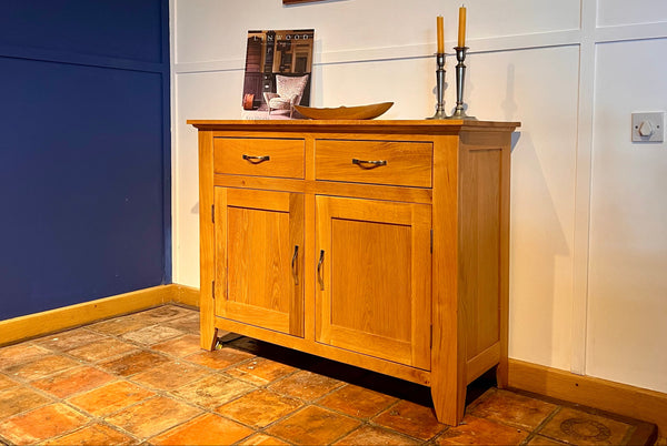 Staplecross oak sideboard against a white wall with a blue accent