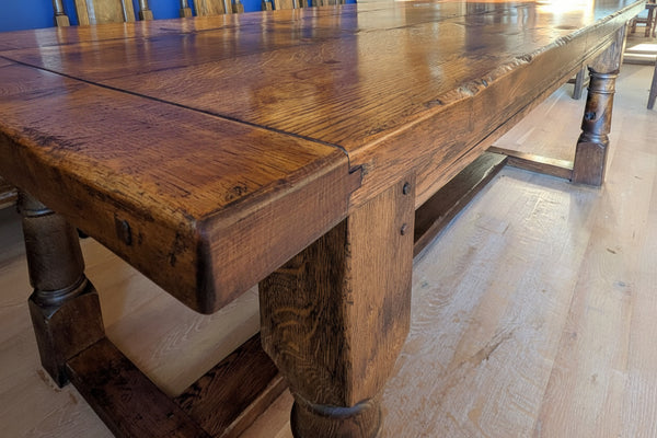 Large handmade English oak refectory dining table close-up of high character distressed timber