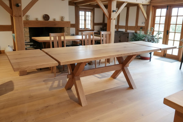 Handmade Sussex extending cross leg oak dining table in an oak framed house