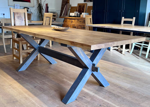 Handmade oak cross leg dining table in Country Ways oak furniture makers showroom