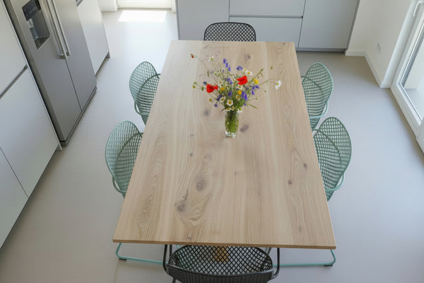 Close up of the top of the handmade Sussex solid oak fine Pillar table in a kitchen setting