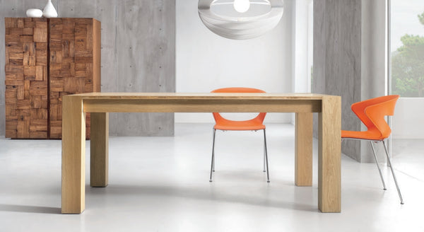 Fixed top solid oak dining table with legs at the corners