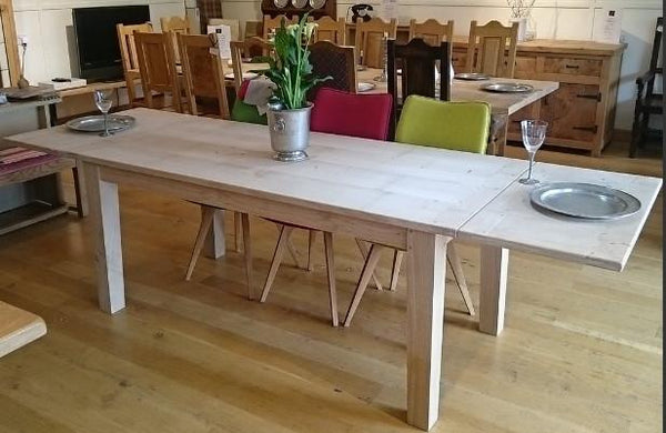 Extended farmhouse dining table showroom