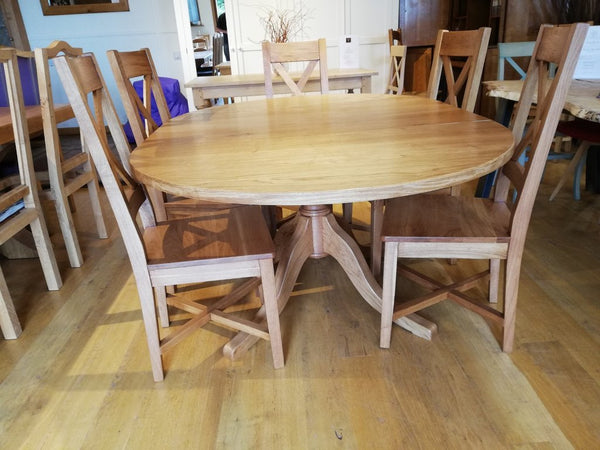 Extending oak pedestal dining table