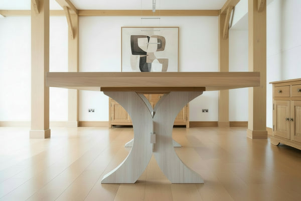 Handmade Moselle extending oak dining table showing the end view in modern oak framed room 
