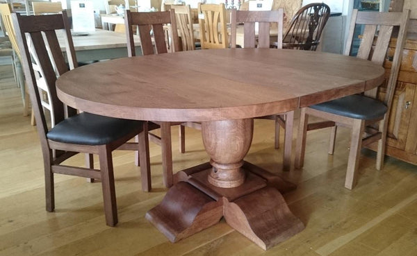 Round oak dining table with extension