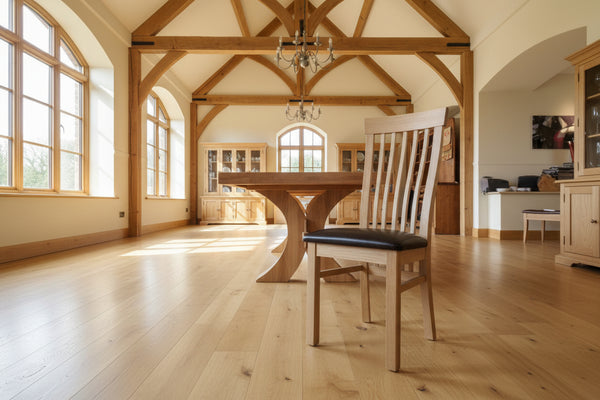 Sedlescombe oak side chair brown faux leather seat in a large oak framed room