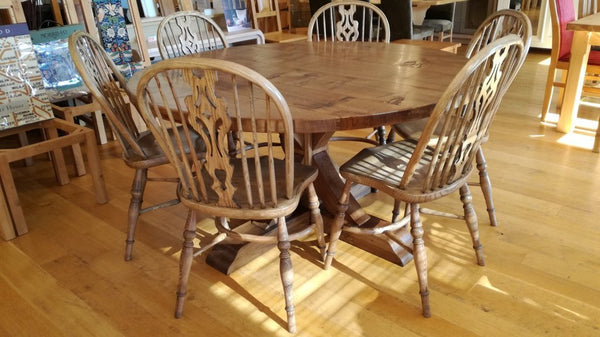 Swailes round oak dining table with braced pedestal and Windsor Chairs