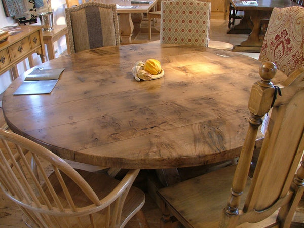 Swailes round oak dining table with braced pedestal with burr oak top