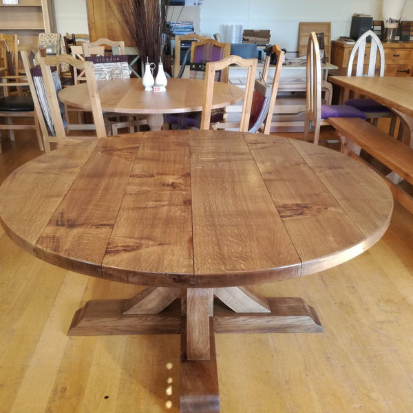 Swailes round oak dining table with braced pedestal top