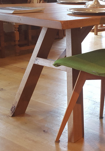 Close up A-frame oak dining table base